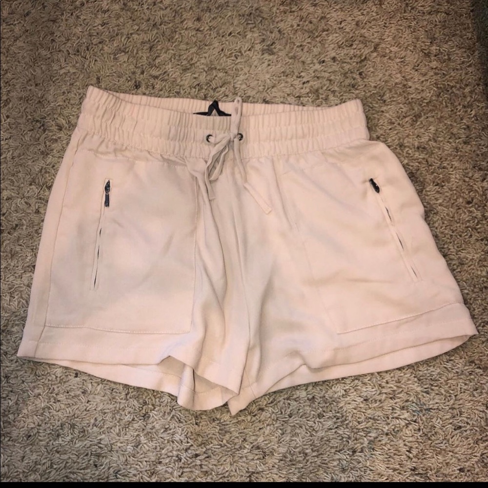Adorable light pink shorts with zippers! Worn once